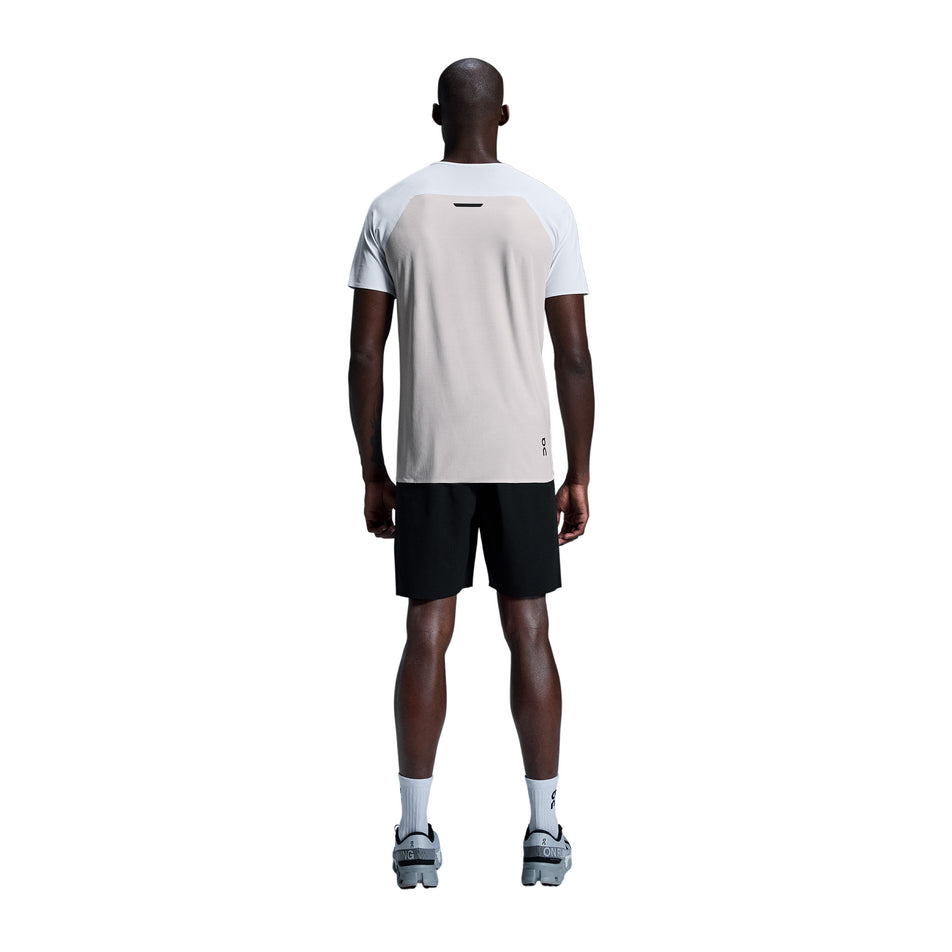 Back view of a model wearing the On Men's Performance-T in the White/Silver colourway. (8715745951906)