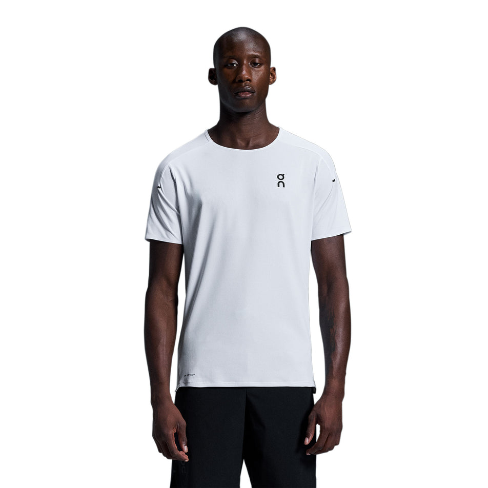 Front view of a model wearing the On Men's Performance-T in the White/Silver colourway. (8715745951906)