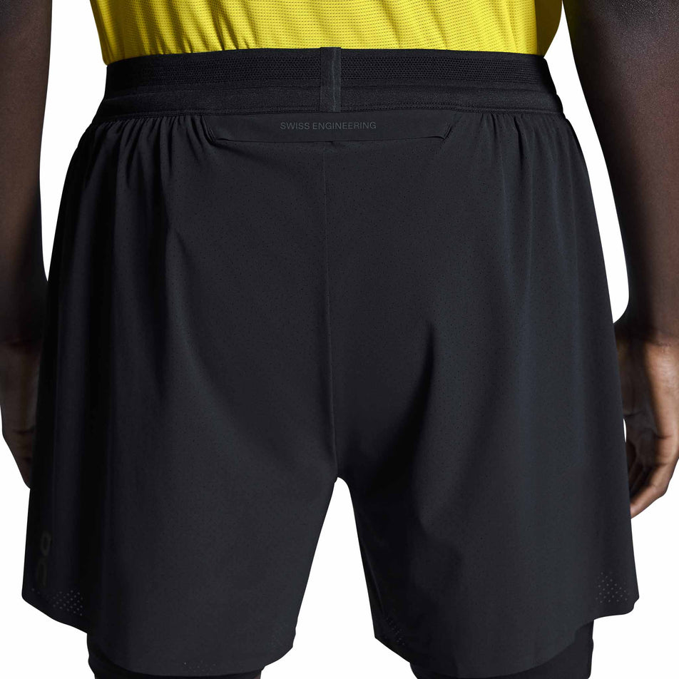 Back view of a model wearing the On Men's 5