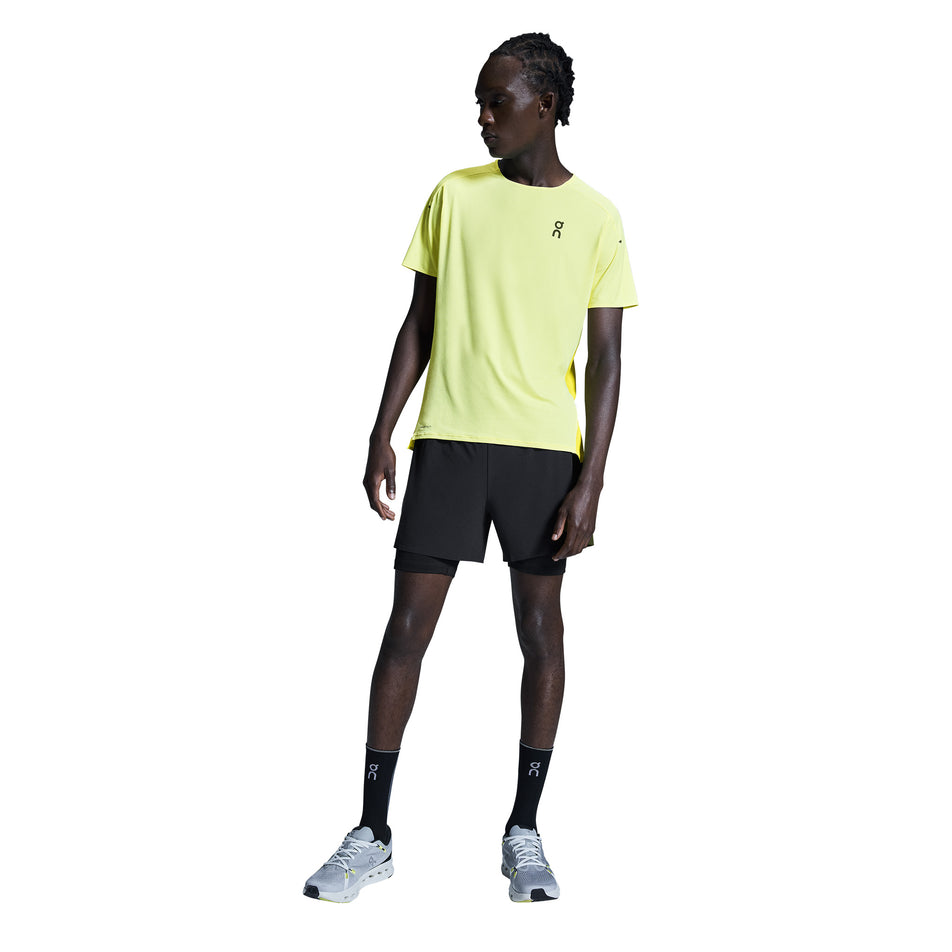 Back view of a model wearing the On Men's 5