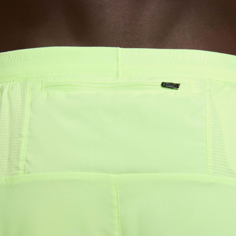 Close-up view of the zipped back pocket on a pair of Nike Men's Stride Dri-FIT 5