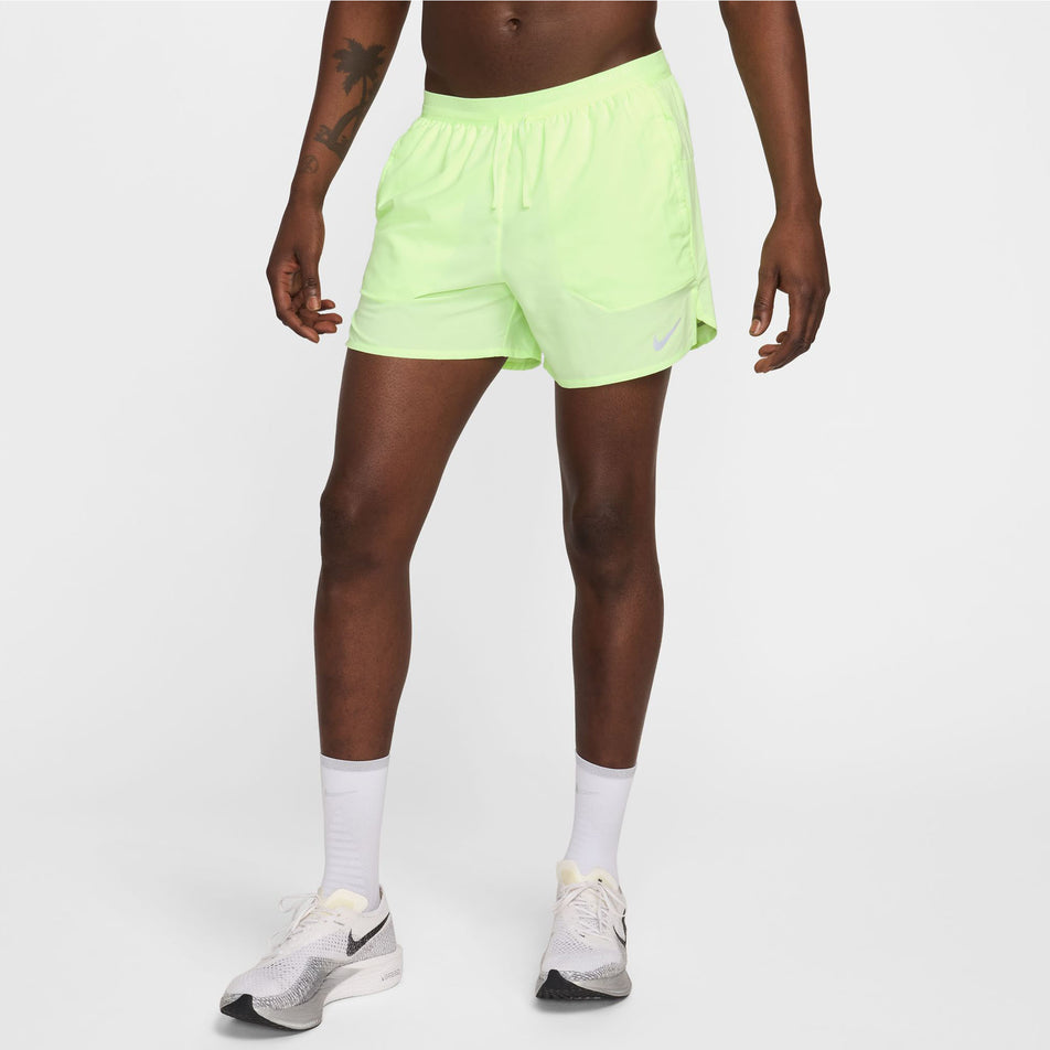 Angled front view of a model wearing a pair of Nike Men's Stride Dri-FIT 5