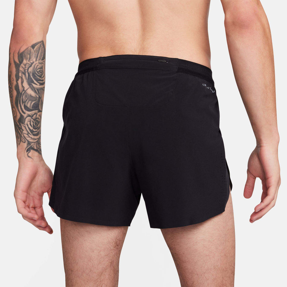 Back view of a model wearing a pair of Nike Men's AeroSwift Dri-FIT ADV 4