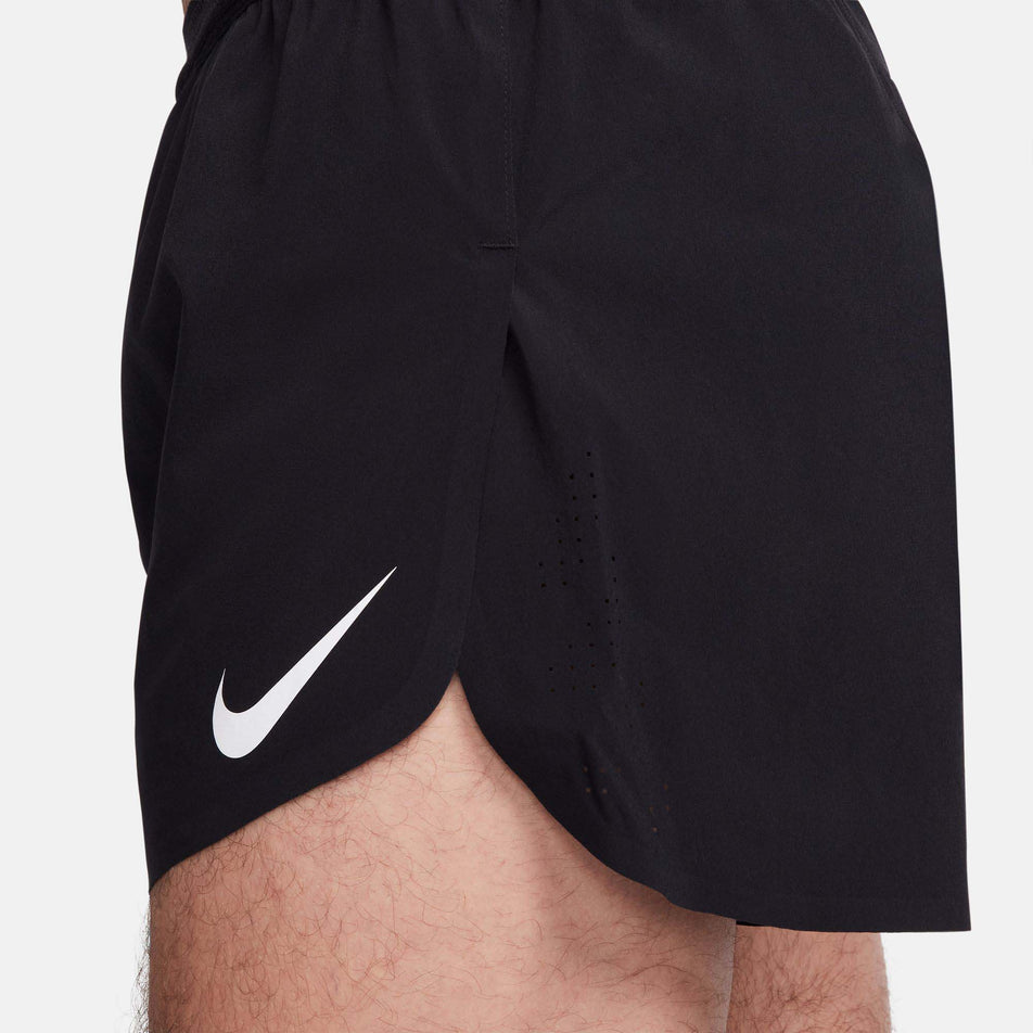 Close-up side view of a model wearing a pair of Nike Men's AeroSwift Dri-FIT ADV 4