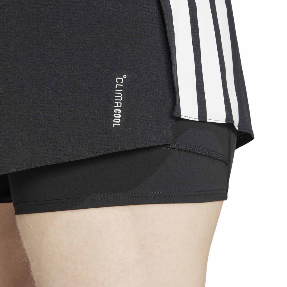 The CLIMACOOL logo on the adidas Men's Adizero 2in1 Short in the Black colourway. (8566982148258)