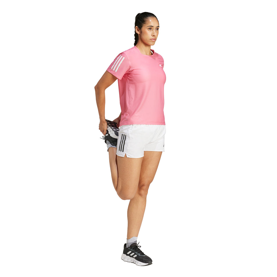 Front view of a model wearing the adidas Women's Own The Run Base Tee in the Pink Fusion colourway. (8567025172642)