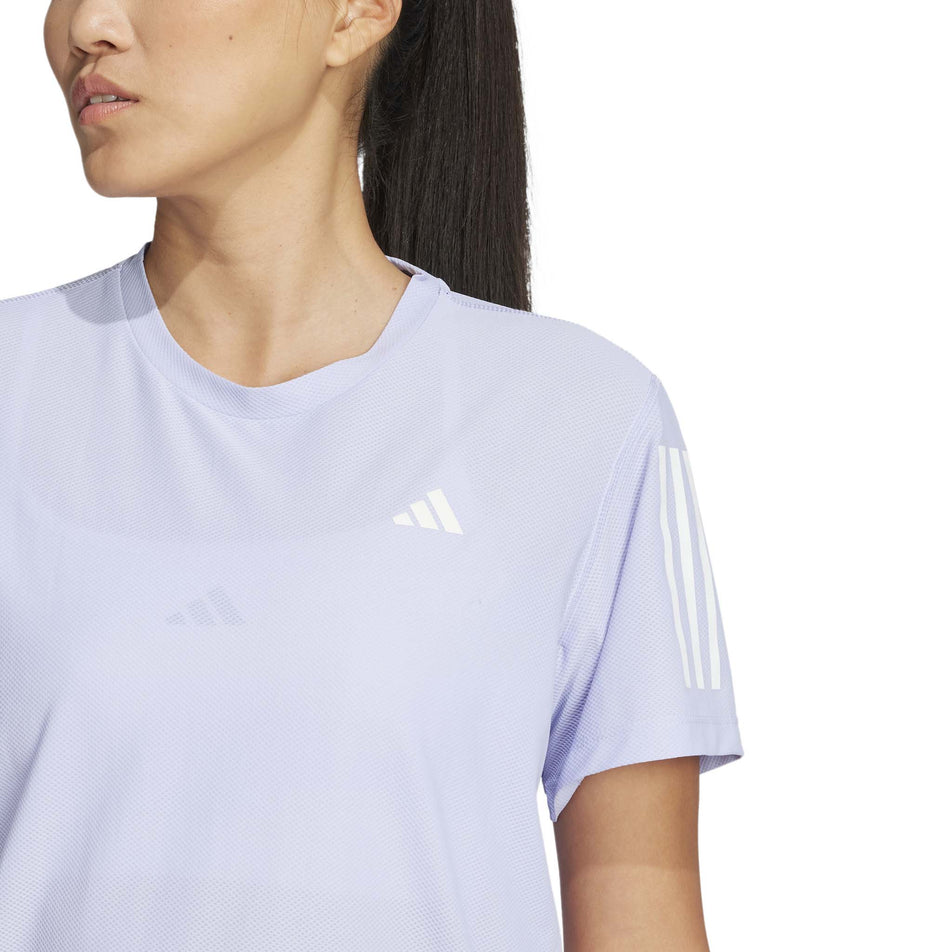 Front view of a model wearing the adidas Women's Own The Run Base Tee in the Violet Tone colourway. (8567459840162)