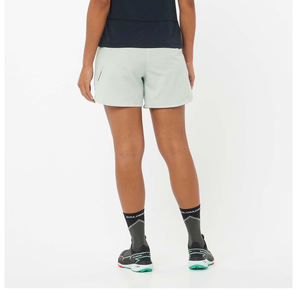 Back view of a model wearing a pair of Salomon Women's Cross 5