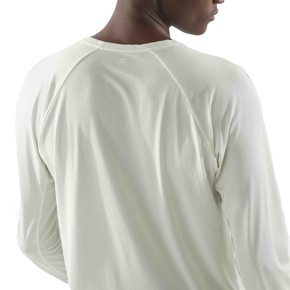 Back view of a model wearing the Salomon Men's SHKout Core Long Sleeve T-Shirt in the Icicle colourway. (8575596200098)