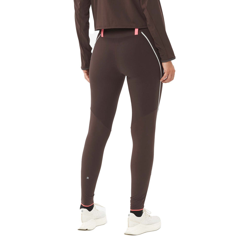 Back view of a model wearing the Salomon Women's Sense Aero Stow Tights in the Coffee Bean colourway. (8574546084002)