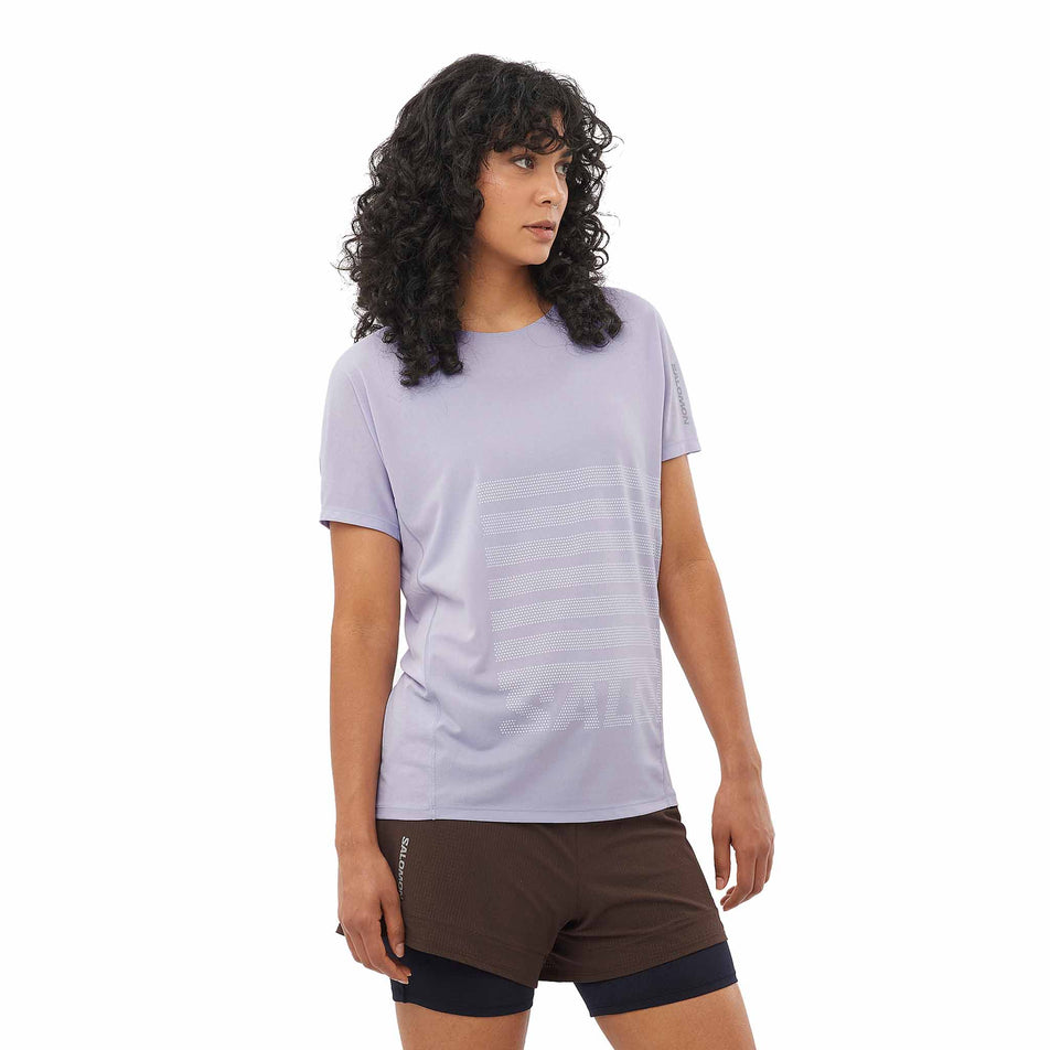 Front view of a model wearing the Salomon Women's Sense Aero Graphic Short Sleeve T-Shirt in the Cosmic Sky/White colourway. (8574209523874)