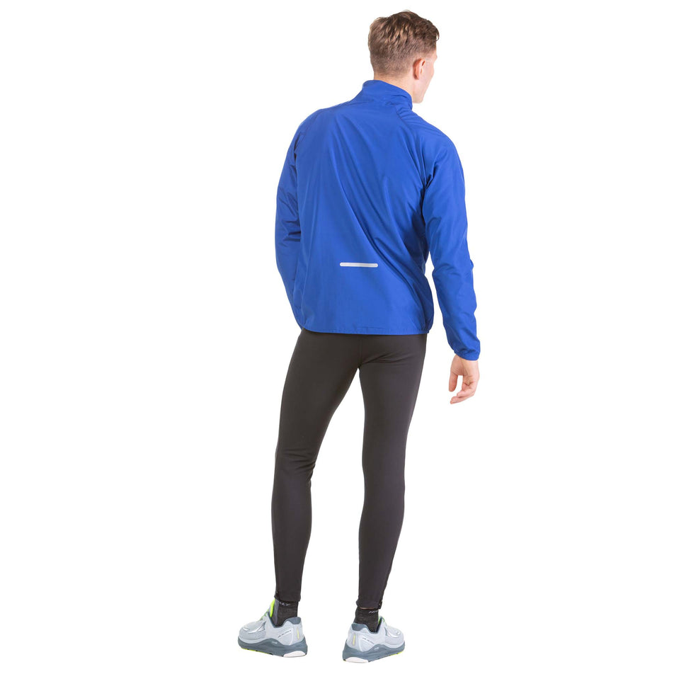 Back view of a model wearing a Ronhill Men's Core Jacket in the Dark Cobalt/Bright White colourway (7573999976610)