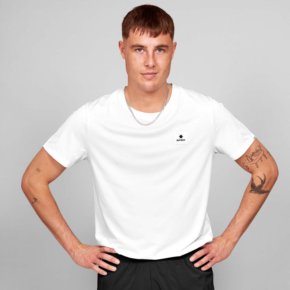 Front view of a model wearing the SAYSKY Men's Clean Combat Pro T-Shirt in the White colourway. Model is also wearing shorts. (8602103316642)