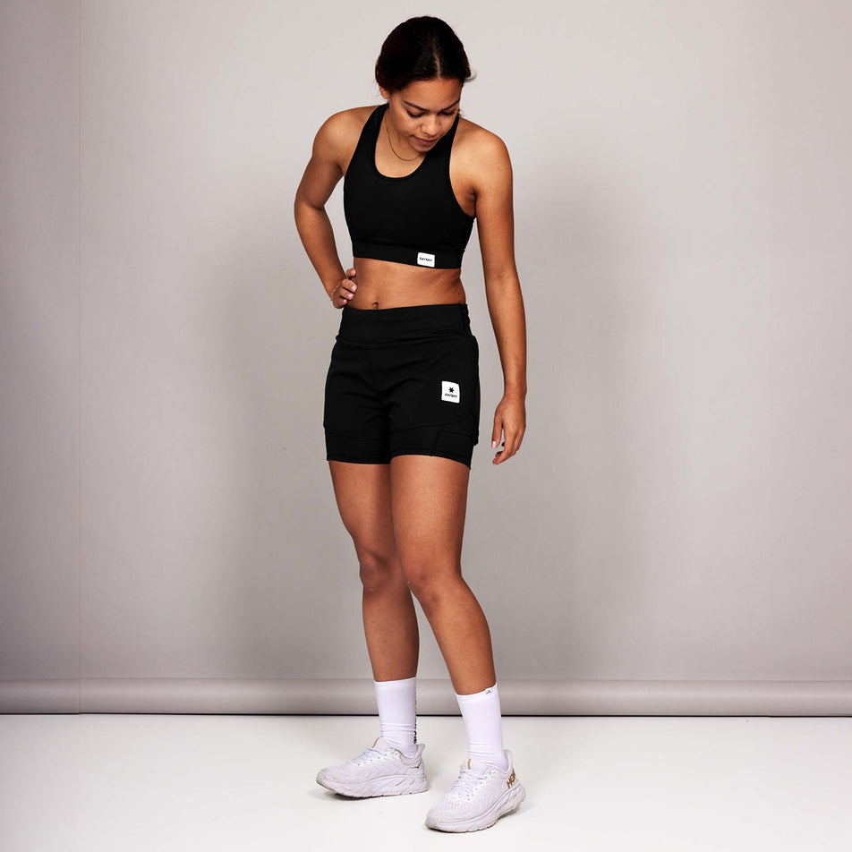 Front view of a model wearing the SAYSKY Women's 2 In 1 Pace Shorts 3